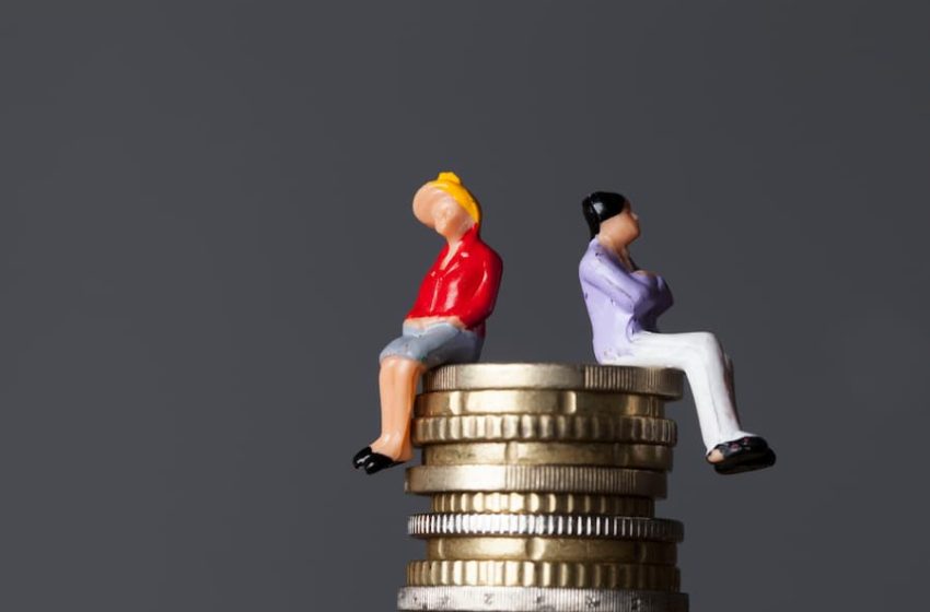 Graphic of a man and a woman sitting on money