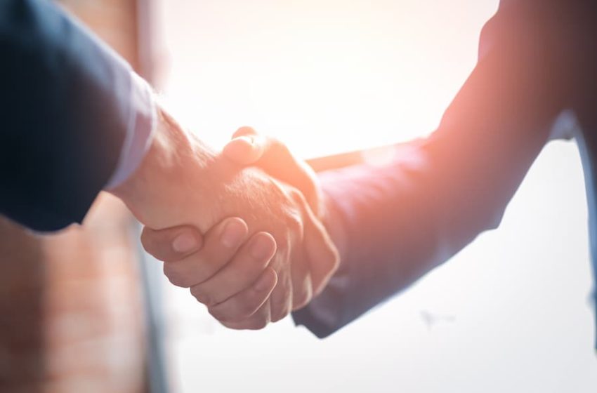 Image of two people shaking hands