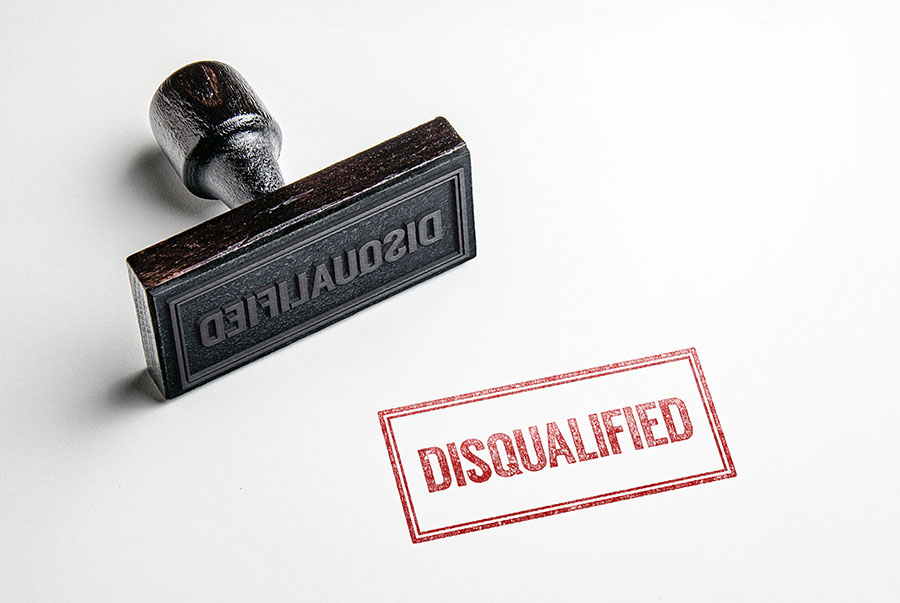 A red ink stamp with the word 'disaqualified'