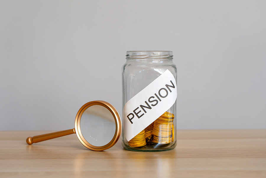 A pot of coins marked 'pension' next to a magnifying glass