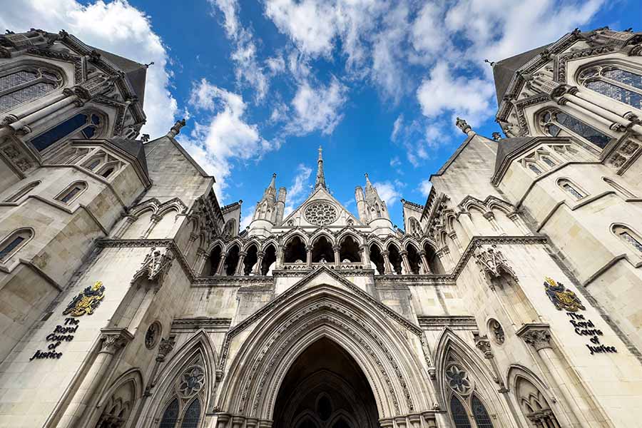 wide shot of the exterior of the royal courts of justice, view from below
