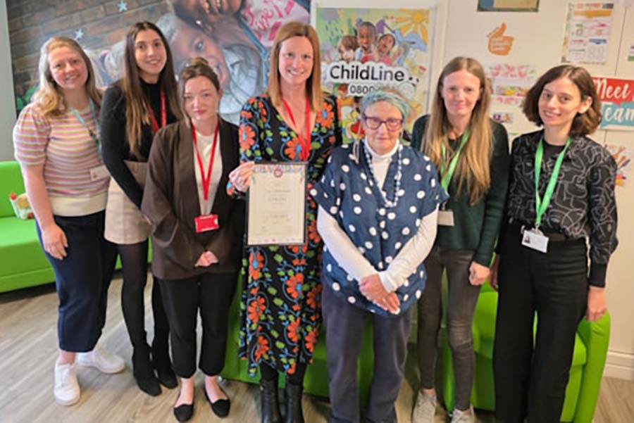 The team at Taylor Bracewell holding up a certificate