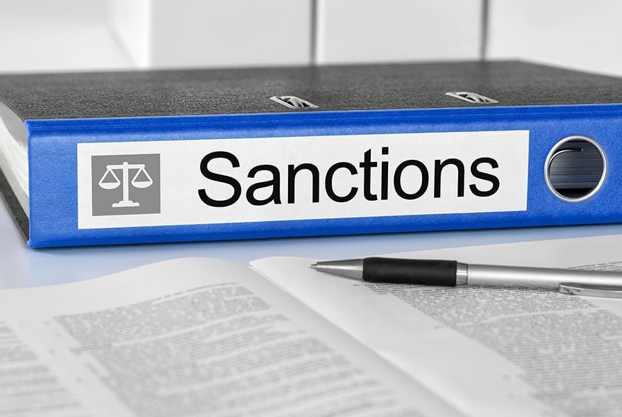 A file with the word 'sanctions' on the side