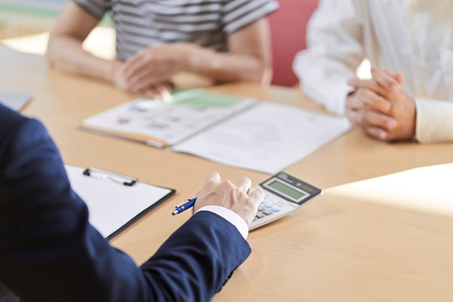 A close-up of a couple receiving tax advice