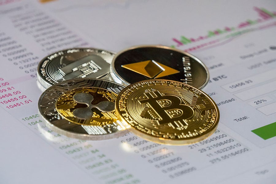 Crypto coins on a finance ledger