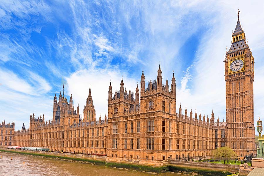 A wide shot of the exterior of the houses of parliament