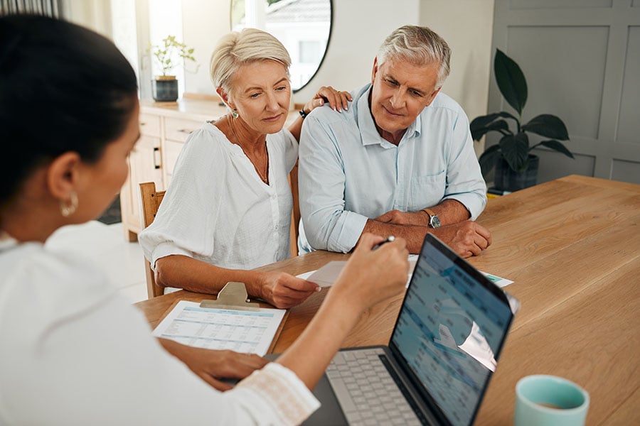 A wealth or high net worth couple receive financial advice