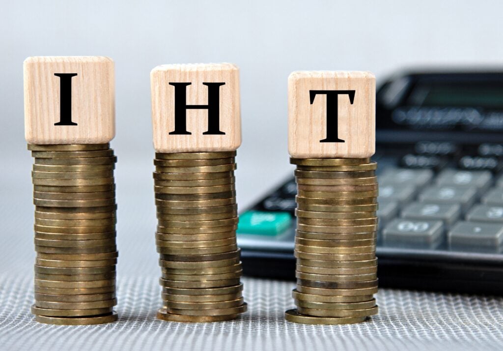 coins with wooden blocks spelling IHT